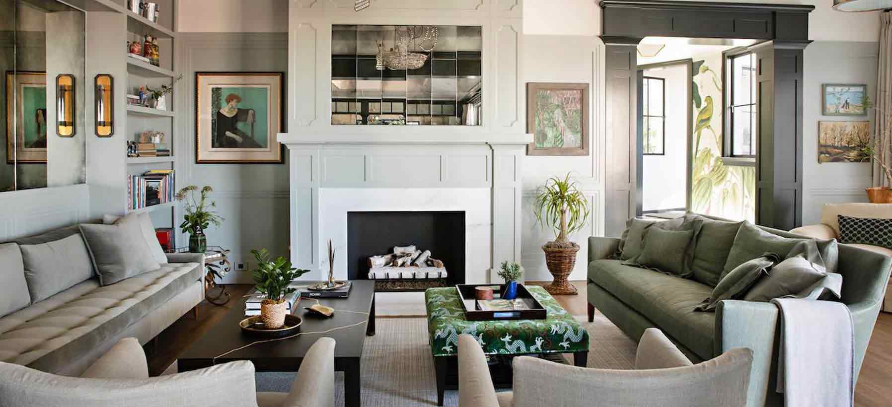 Living room with fireplace, seating and natural light