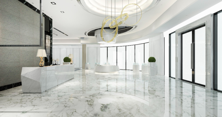 Bright residential interior with large windows, a chandelier and open floor space